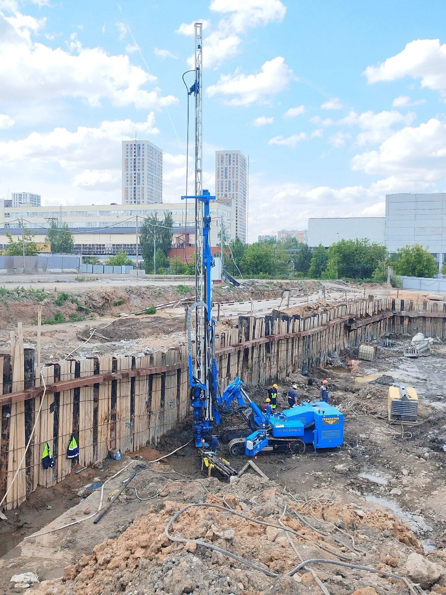 Blue rotary drill working on foundation stabilization project