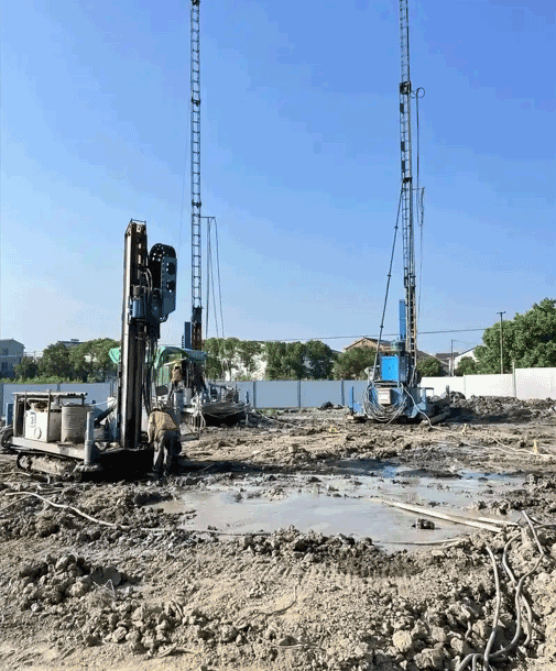 Track-mounted drilling rig performing ground improvement on site