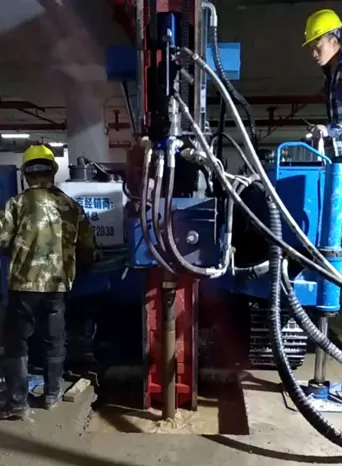 Workers operating MXL-150D2 drill for expanded head anchor construction